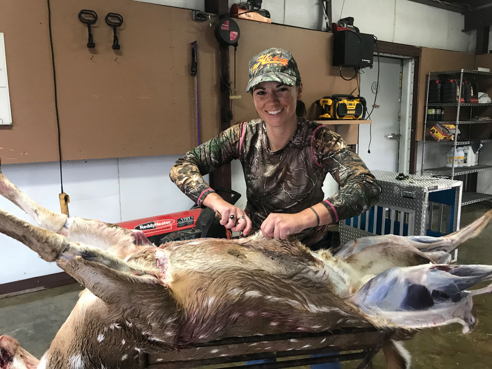 Martha Spencer cleaning a deer after the hunt